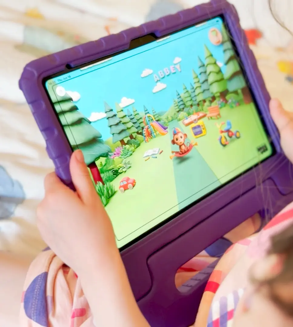 A child playing a Meevee game on a tablet